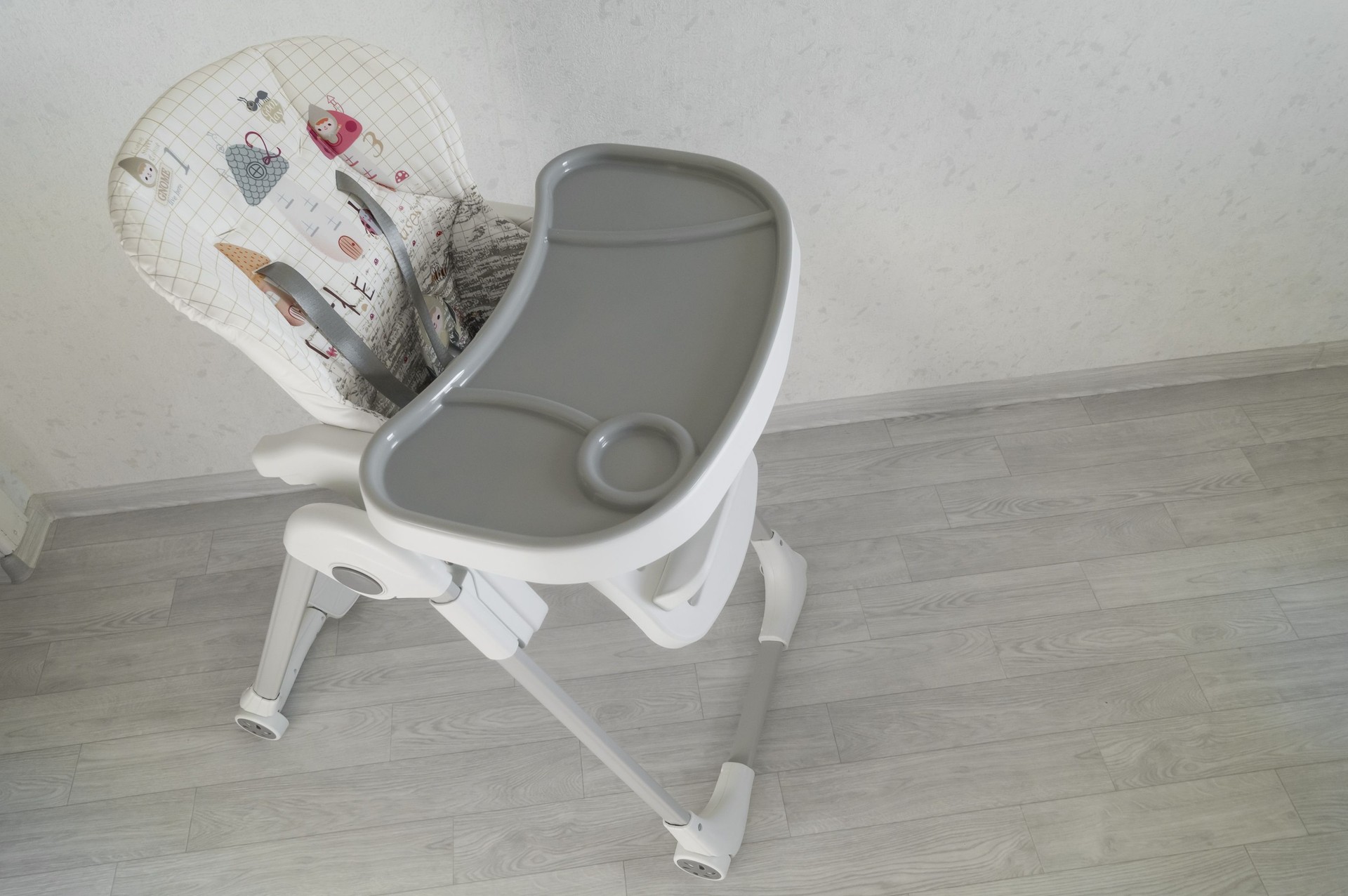 Baby high chair. Special children's furniture for feeding babies. Selective focus